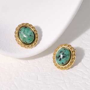 Vintage oval gold-tone stud earrings with green textured stone inlay and twisted edge