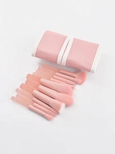 Pink makeup brush set with gradient bristles and matching leather storage bag