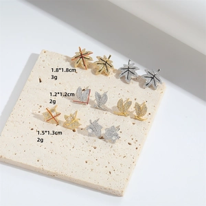 Exquisite maple leaf stud earrings set with sparkling cubic zirconia in gold and silver