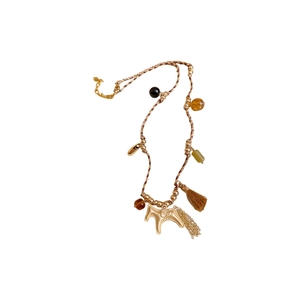 Braided necklace featuring golden horse pendant with brown tassels and beads on white background