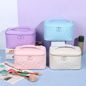 Set of Y2K style heart embossed PU leather makeup bags in purple, blue, pink and white