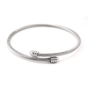 Macro shot of silver cable twisted wire open cuff bracelet with polished end caps