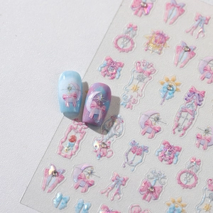 Pastel bow nail stickers with moon and star glitter patterns for DIY manicure designs