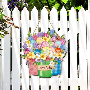 Wooden Happy Easter floral welcome sign hanging on a white garden fence with flowers