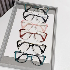 Collection of cat-eye optical frames in multiple colors on a white display tray