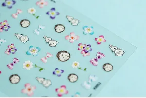 Detail view of 5D Japanese cartoon nail stickers with rabbits, cherry blossoms, and glitter
