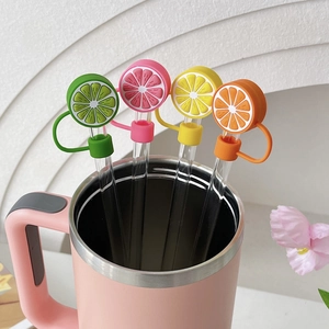 Set of 4 fruit shaped silicone straw covers with lemon and citrus designs for tumblers