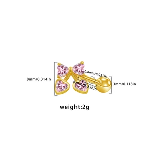 Close-up of pink heart stud earring showing size specs and dimensions of 8mm by 6mm
