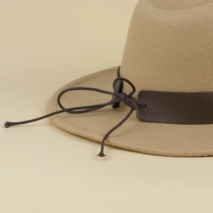 Detail view of khaki wool fedora hat with brown leather band and decorative knot