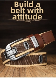 Close-up of vintage canvas belt with metal pin buckle and leather detail on wood