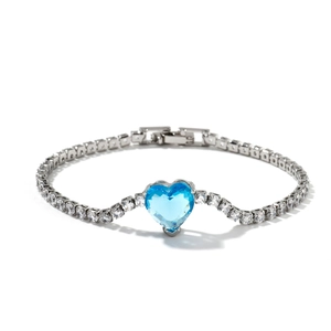 Elegant silver bracelet with a heart-shaped sea blue crystal and sparkling zircon chain