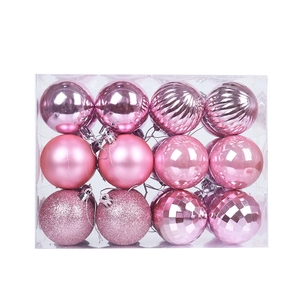 Pink Christmas ornaments set with mixed textures in a clear box for holiday decoration