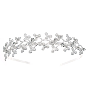 Detail shot of a silver rhinestone crown headband with sparkling butterfly motifs