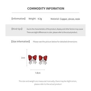 Detail specifications card for red bow clip earrings with zircon and silver copper finish
