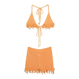 Handmade crochet bikini set in apricot orange with colorful bead detailing for beachwear