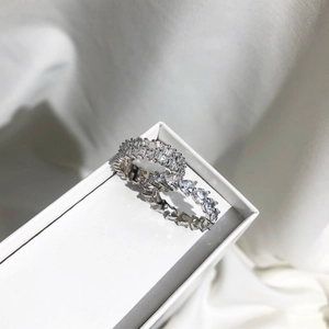 Close-up of S925 silver eternity rings with heart and trapezoid cut cubic zirconia