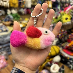 Handmade wool felt octopus fish keychain with colorful pink and yellow body and metal ring