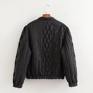 Back view of black quilted jacket with asymmetric geometric patterns and elastic hem