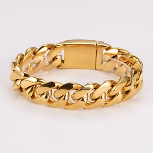 Chunky gold stainless steel Cuban link bracelet with square clasp on display stand