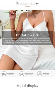 Detail of white imitation silk satin fabric texture showing smooth drape and glossy finish