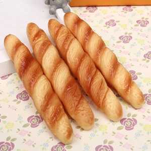 Macro detail of four realistic simulation baguette bread pens with textured crust finish