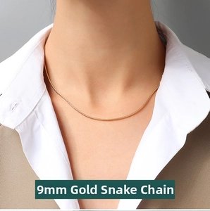 Detail view of 1.3mm gold round snake chain necklace worn with casual business attire