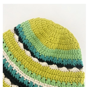 Close-up of multicolor crochet floral knit hat showing thick yarn texture and craftsmanship