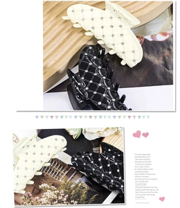 Detail view of large checkered hair claws with sparkling crystals and elegant diamond pattern