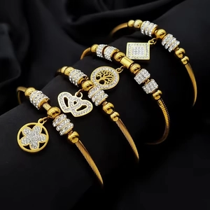 Lot de 4 bracelets dorés avec breloques Arbre de Vie et couronne sur soie noire élégante