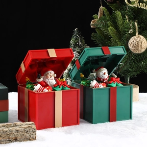 Leuchtende Weihnachtsspieluhr mit Weihnachtsmann und Schneemann in einer Geschenkbox