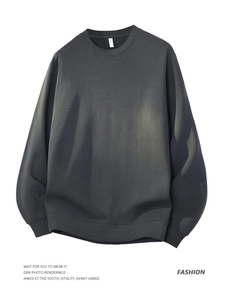 Detail of dark grey fleece sweatshirt featuring ribbed cuffs and heavy knit texture