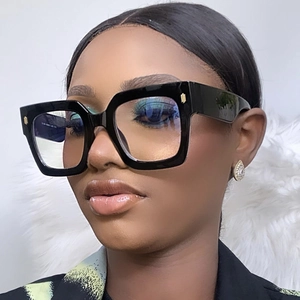Close-up of black square frame glasses with lightweight TR90 material worn by a model