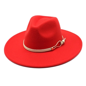 Classic wide-brimmed red wool fedora hat with white leather band and gold buckle