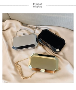 Three octagonal evening bags in gold, silver and black with vintage kiss-lock on satin