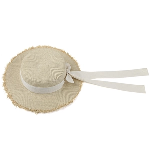 Elegant women's flat top straw sun hat with white bow ribbon and fringe brim detail