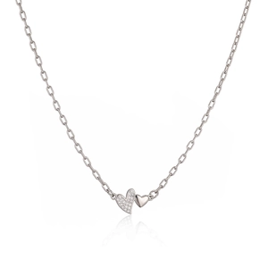 Detail of silver double heart necklace featuring a polished heart and a sparkling paved heart