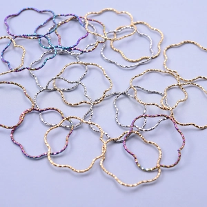 Macro view of irregular wave-shaped 304 stainless steel jewelry rings in various colors