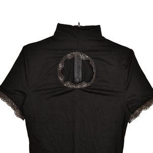 Detailed back view of a black lace top with a hollow circular cutout and zipper closure
