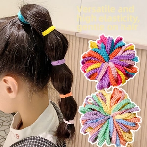Macro view of multi-colored seamless elastic hair ties with wavy fabric texture