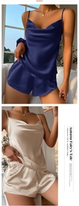 Close-up of satin silk pajamas showing cowl neck tank top and shorts in navy and champagne