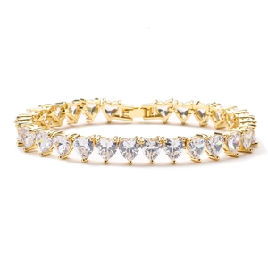Classic gold tennis bracelet featuring heart-shaped cubic zirconia and secure box clasp