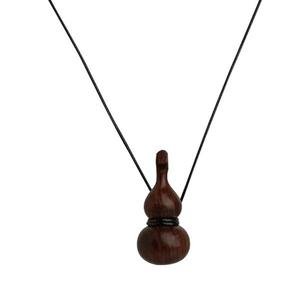 Minimalist wooden gourd pendant necklace with adjustable black cord on a white background