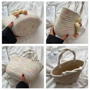 Close-up of woven handbag showing colorful wave patterns and soft cotton rope handles
