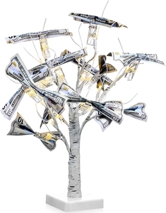 Close-up of LED birch tree money holder with warm lights and transparent photo clips