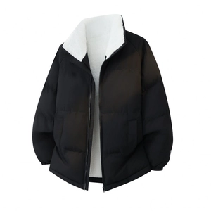 Detail of black puffer jacket showing stand collar with white fleece lining and zipper