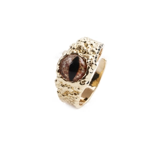 Vintage gold adjustable ring featuring a brown cat eye stone with hammered metal texture