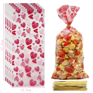 Transparent Valentine candy bag with pink hearts, dimensions 27.5x12.5cm with gold ties