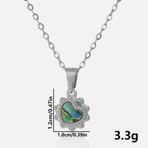 Detail view of heart shell pendant with dimensions 1.2cm height and 1.0cm width