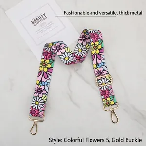 Detail of colorful floral wide bag strap with premium gold metal hooks and buckle