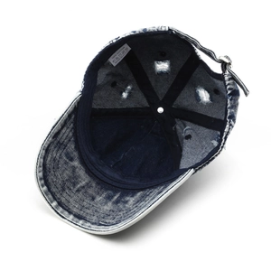 Internal view of washed denim baseball cap showing 100% cotton fabric and stitching details